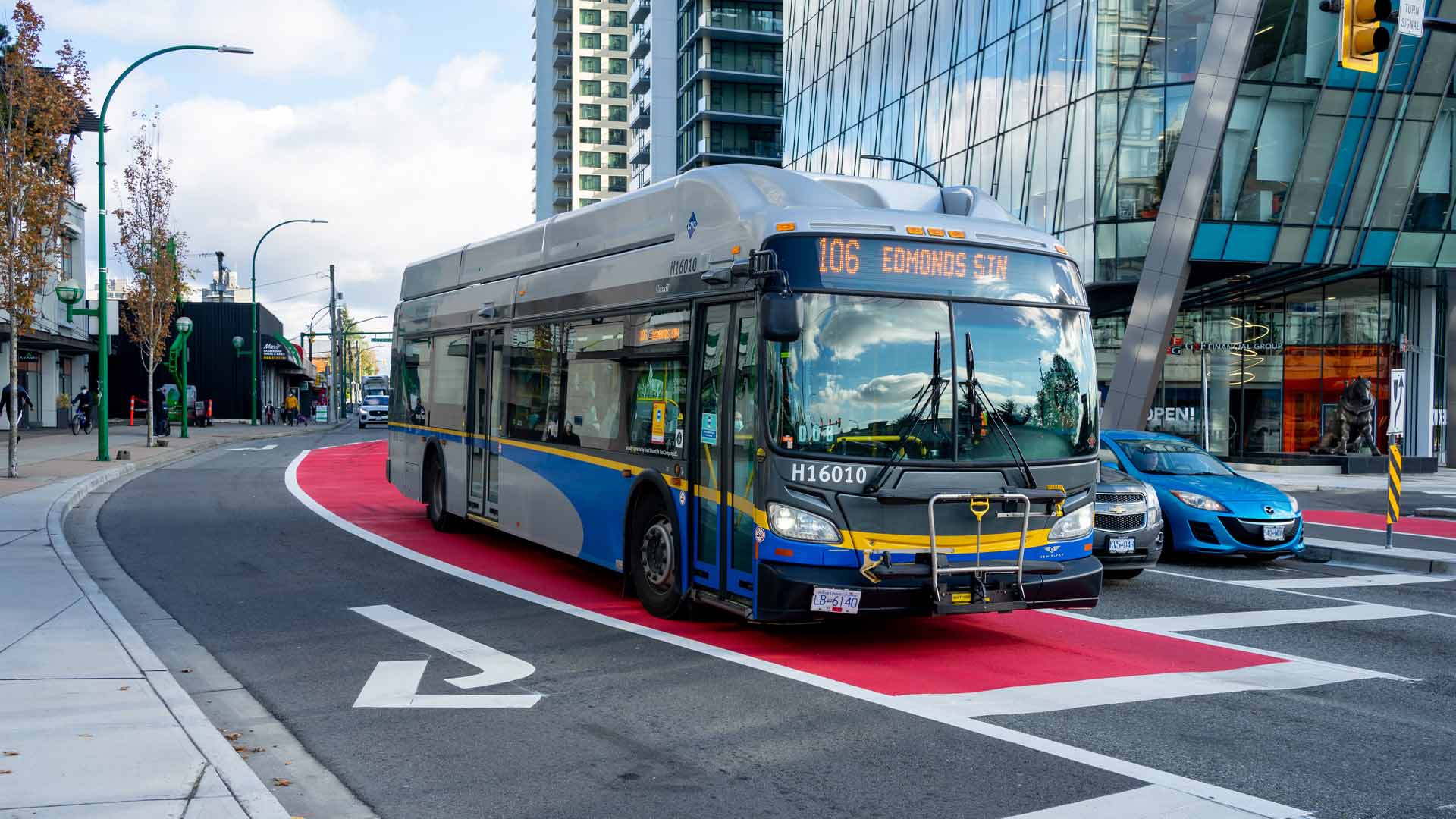 Bus 106 in service near Kingsway, traveling along the road with passengers on board.