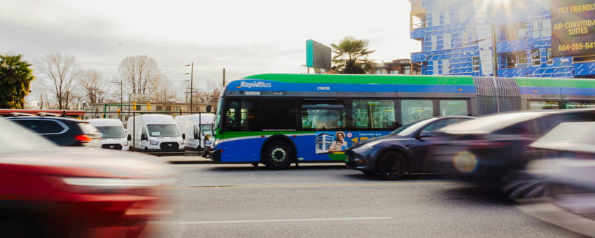 RapidBus on Marine Drive surrounded by moving traffic